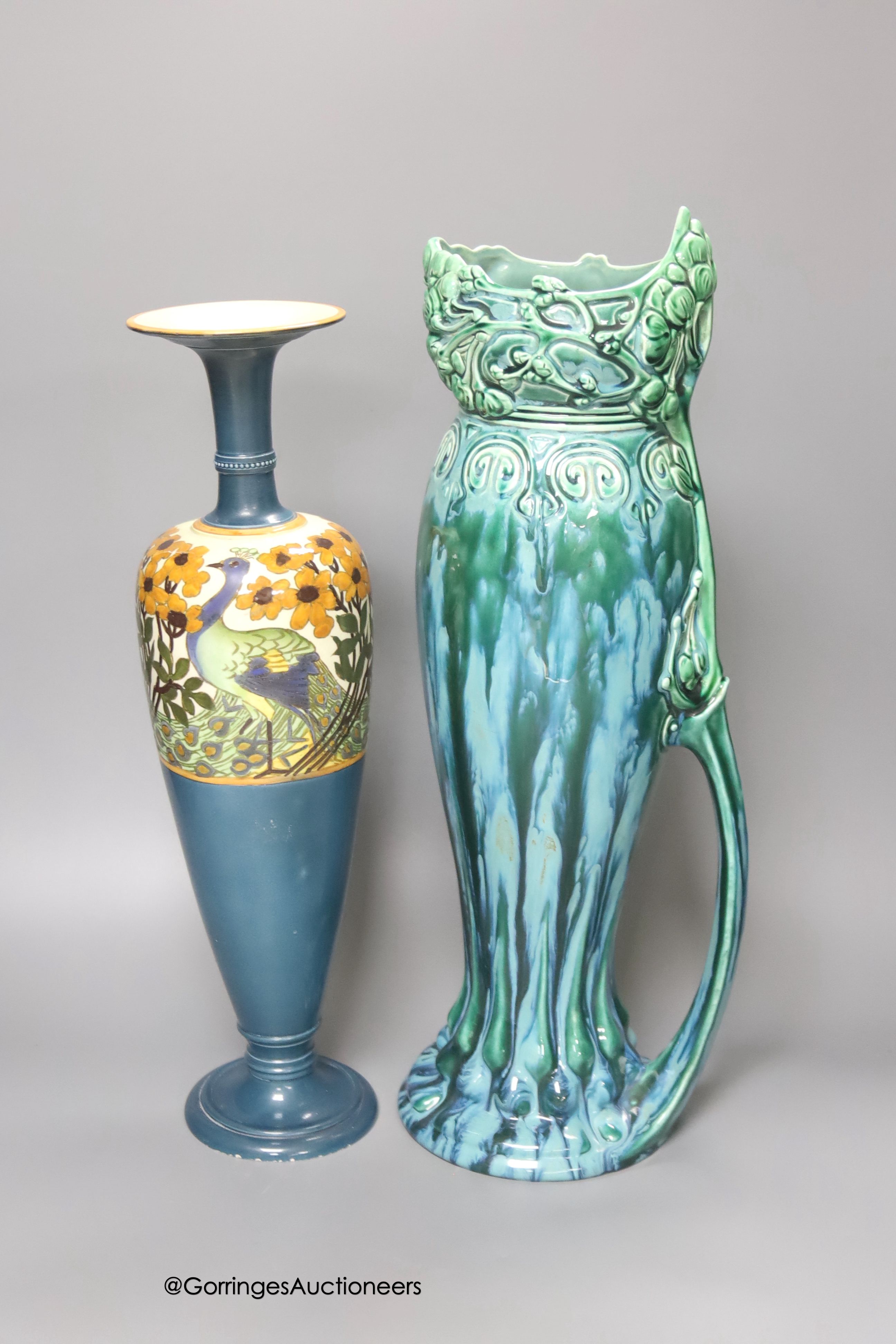 A Royal Staffordshire pottery peacock vase, height 38cm and an Austrian Julius Dressler earthenware ewer with green glaze effects